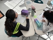 Fifth grade students participating in a science lesson