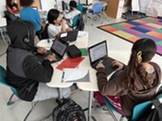 Students working on their laptops.