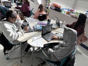 Students working on their laptops.