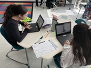 Students working on their laptops.