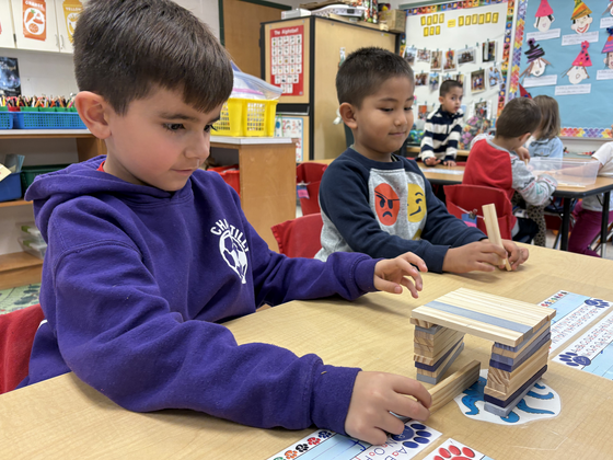 Students building with blocks