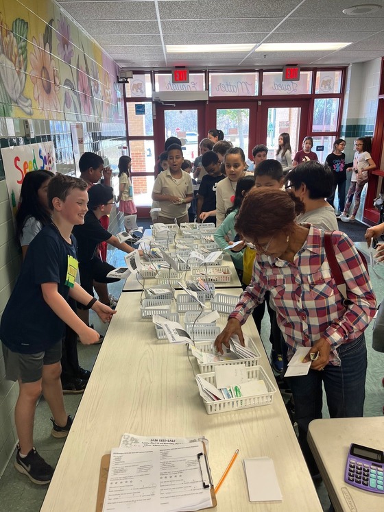 3rd graders selling seeds