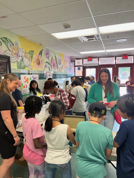3rd graders working at the seed sale