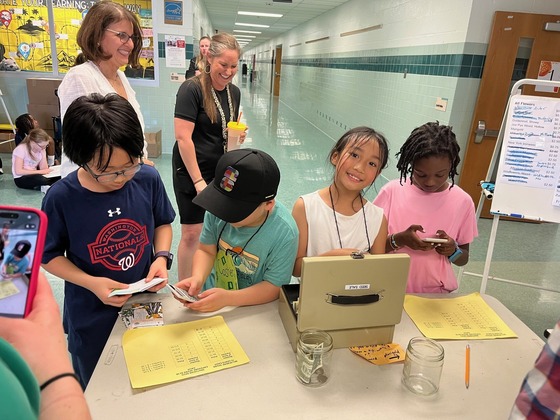 3rd graders working as cashiers at the seed sale