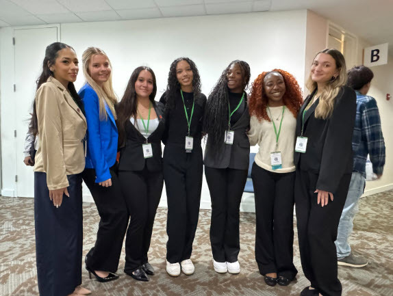 students in a line, in business attire