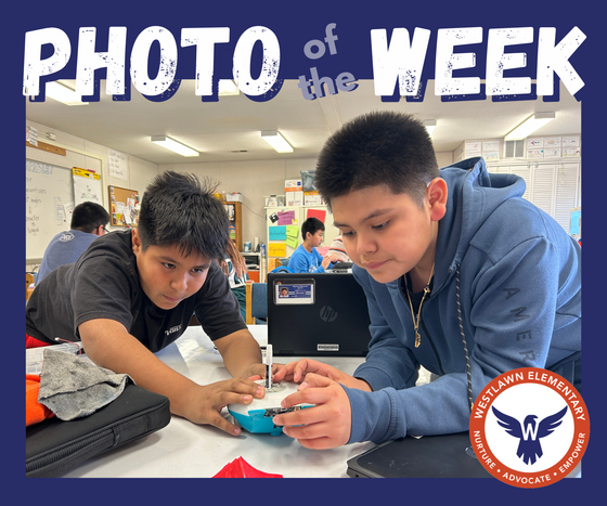 Photo of the Week: two students program a Finch robot in STEAM class