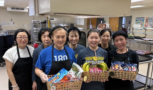 Food and Nutrition Services Team holding gift baskets