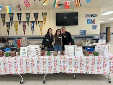 School volunteers selling donuts