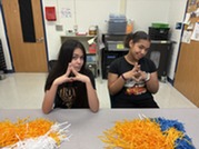 Two anchors filming the student news show. 