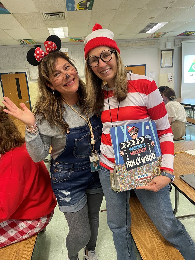 Two female teachers dressed up a characters in the book Where's Waldo Hollywood for Book Character day