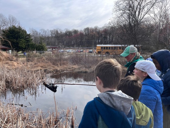 Outdoor Club looking at the pond