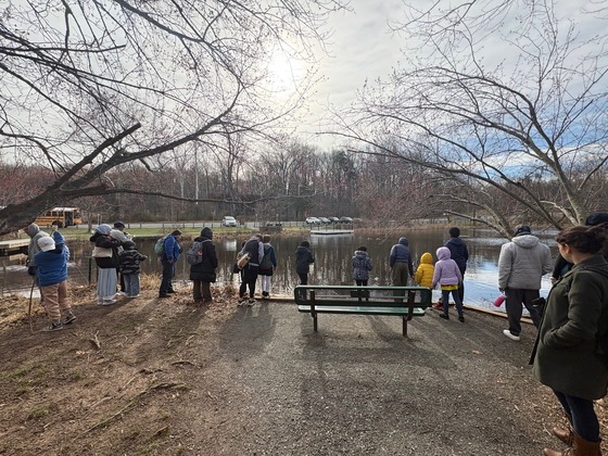 students around the pond