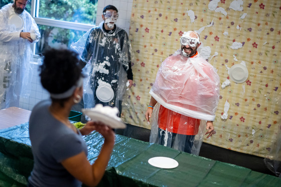 adults participating in pi day celebration 1
