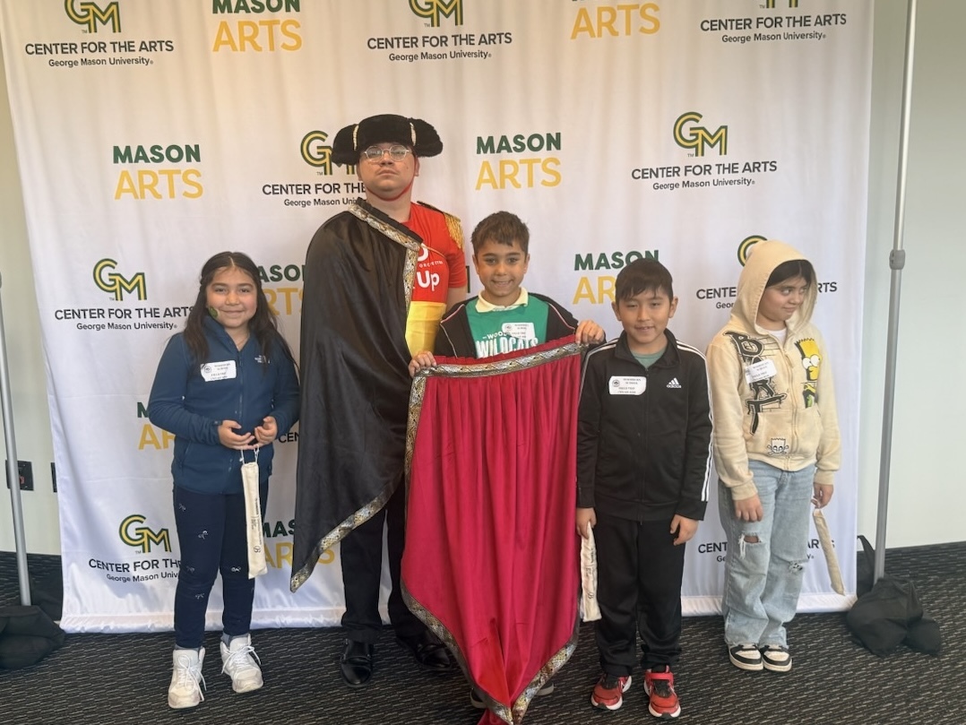 Students pose with a student from George Mason University