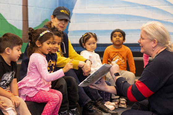 Ms. Burke with Students in the Library