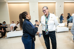 Dr. Reid speaks to a community member