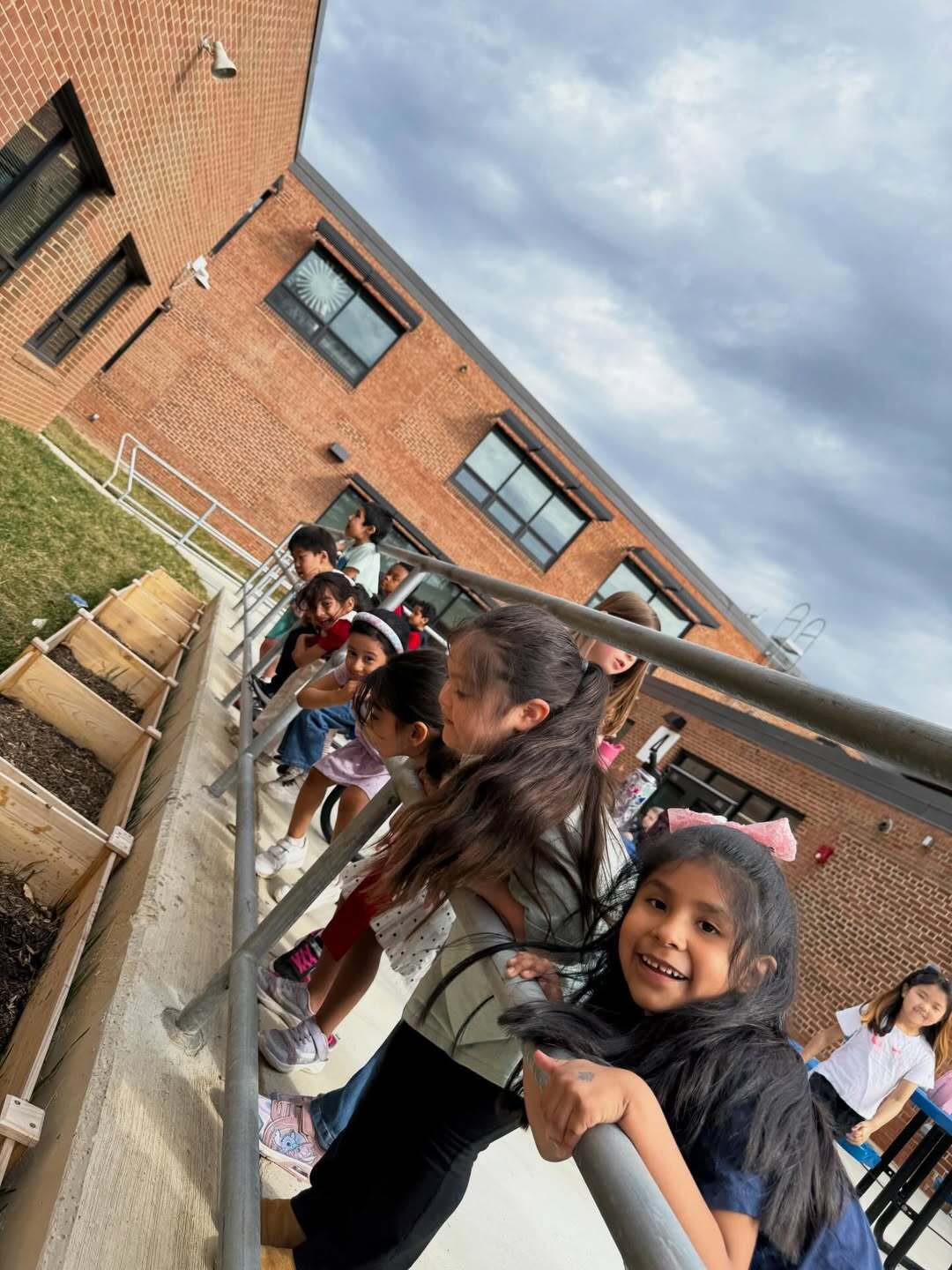 students outside looking at planters 