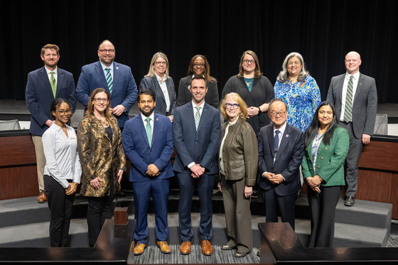 Tom Dannan with full board and guests after being sworn in.