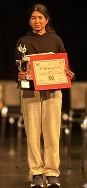 Rocky Run student Aadhya V. with her Spelling Bee trophy