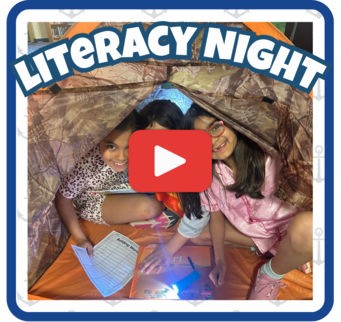 Image of students in a tent smiling and holding items to read and a flashlight