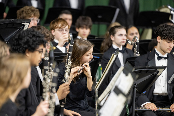 Students in band performing with their instruments