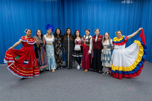 Franconia Elementary School staff members pose for a picture in their cultural attire during the school’s International Fashion Show
