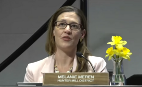Melanie Meren on a School Board Meeting talking