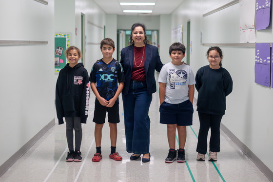 Ms. Iyer with a group of students 