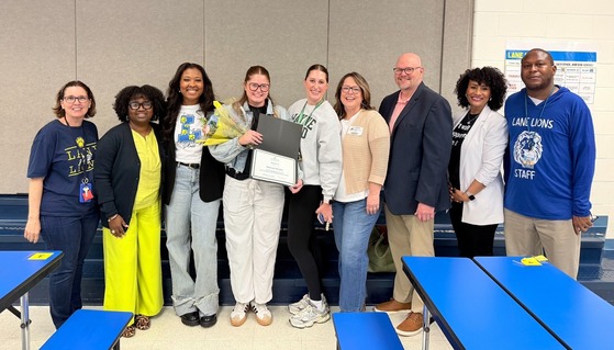 Miss Shipley posing with Lane and FCPS leaders