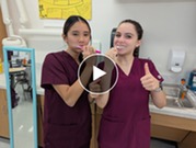 Dental students brushing their teeth