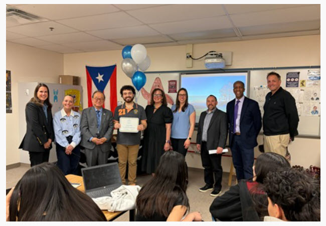 Mr. Perez being awarded at Fairfax HS