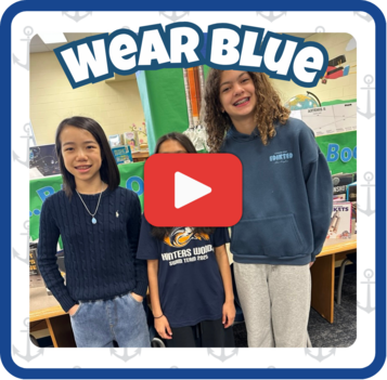 Three students smiling, standing in the library, wearing blue. Framed. With a play button on image. 