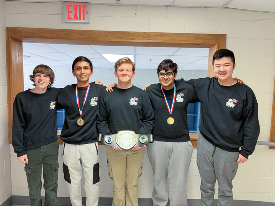 The five officers of the TJ Computer Security Club lined up for picture in TJ hallway.