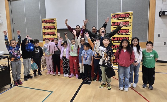 Students pose with our radio host 