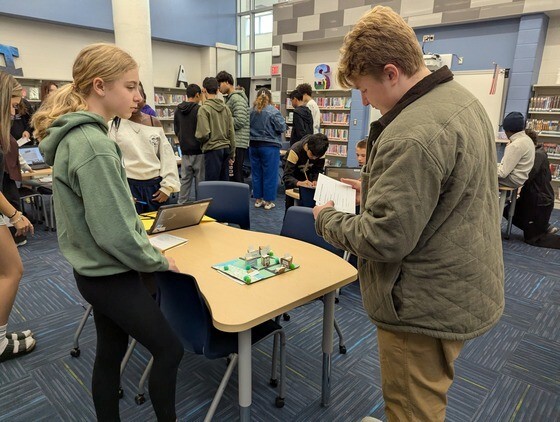 Students standing together speaking French