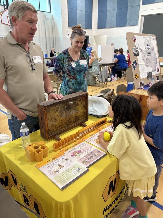 students with beekeeper at Career Fair