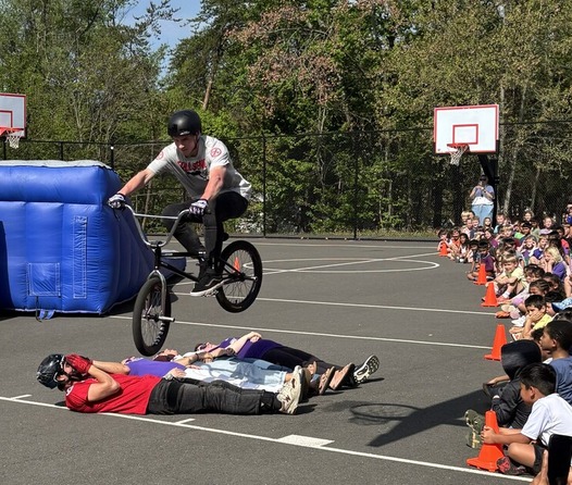 BMX Rider jumping over 5 people