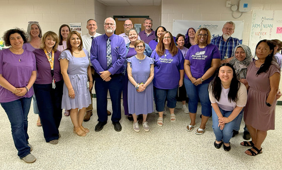 staff in purple clothing to show support for military connected families