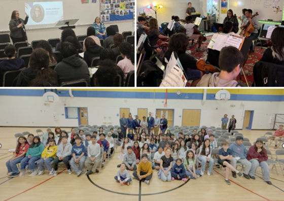Adults speaking to and posing with seated students