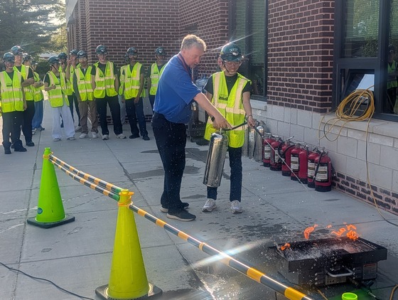 Student putting out a fire
