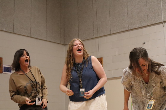 Picture of Kindergarten Teachers Flynn, Olson, and Wideman laughing after playing the Cookie Face Challenge Game
