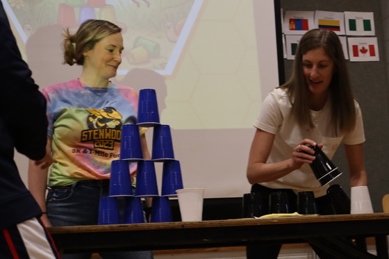 Picture of 3rd Grade teacher Mrs. Fleury and 4th Grade teacher Mrs. Kromer playing the Cup Stacking Game