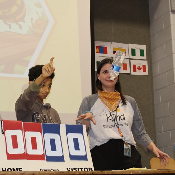 Picture of 4th grade teacher Mrs. Shope playing the Bottle Flip Game