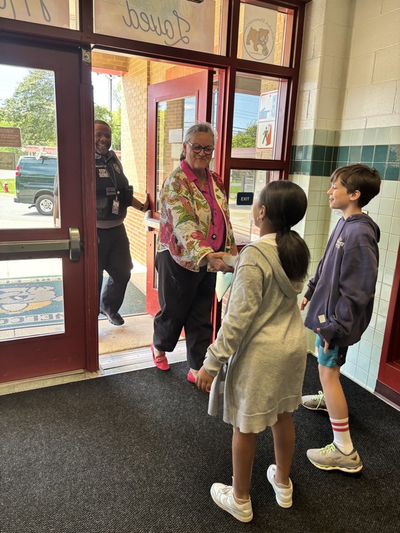 5th grader greeting Dr. Reid