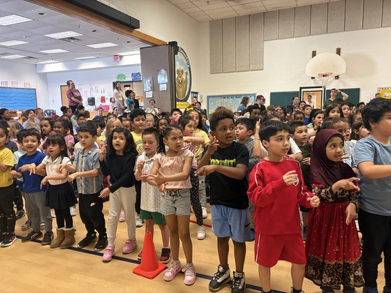 Children practicing a song for Heritage Festival