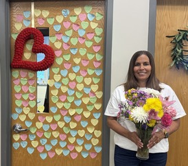 photo of Mrs. Bentley with flowers and hearts on door