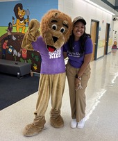 Mrs. Opie with Mr. Paws wearing Purple Up shirts