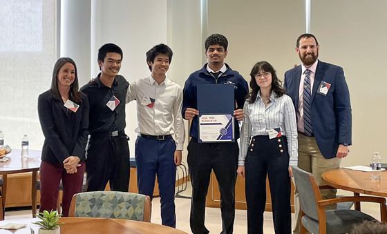 TJ's Second place team poses with their runner-up certificate