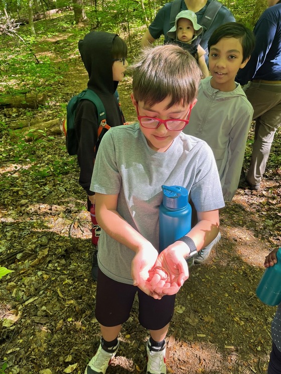 Student holding a newt at Turkey Run Park