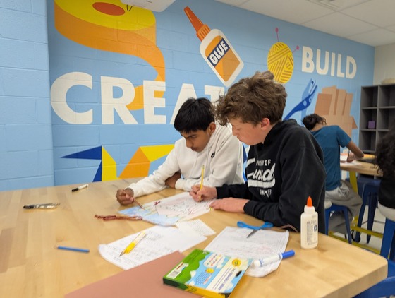 Spanish 2 students working in the library